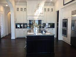 Wood floor kitchen ideas awesome dark wood kitchen cabinets home description: Shaddock Model Home Frisco Tx Gorgeous Kitchen Kitchen Flooring Dark Floors Black Appliances Kitchen