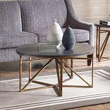60's inspired silhouette with a modern twist of golden bronze wood top and antique bronze wired frames for an updated look. Madison Park Kayden Antique Bronze Coffee Table Bronze Coffee Table Coffee Table Coffee Table Wood