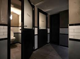 Commercial bathroom designs can be made through a complete makeover of the bathroom with changes in flooring, walls and pipes, or through simple changes of fixtures such as faucets, towel racks, tubs, sinks and toilets which also leave a mesmerizing effect. Industrial Bathroom Door Trendecors