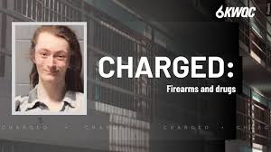 Man charged after 11 firearms found