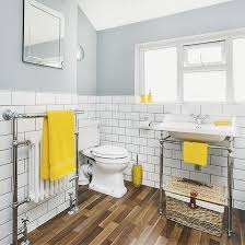 Yellow Bathroom Decorating Ideas New White And Grey Bathroom With Yellow Accents And Faux Wood F In 2020 Yellow Bathrooms Yellow Bathroom Decor Gray And White Bathroom