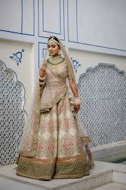 Royal Jaipur Wedding With A Couple In Voguish Outfits Bridal Lehenga Images Indian Bride Outfits Indian Bridal Outfits