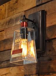 1800 Reposado Tequila Wall Sconce Unique Bar Lighting Eine Ausgefallene Idee Aus Einer 1800 Reposado Tequila In 2020 Diy Bottle Lamp Bottle Chandelier Bottle Lamp