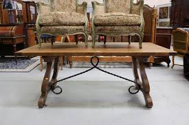 A charming 17th century style dining table, reconstructed from reclaimed teak wood that stands on smooth polished lyra legs conjoined with iron stretchers. Spanish Dining Table With Wrought Iron Support Base 75 Cm High Tables Dining Other Large Furniture