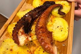 Stir in the paprika, bay leaf, potatoes, salt, and a little of the potato water. Octopus With Potatoes Tapas In Javea A La Deriva Cerveceria Javea Com Xabia Com