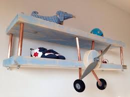Think vintage airplane mobiles, airplane shelves and some wall decors that you can make on a budget. Airplane Decor For Kids