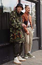 Rabbithole London Image Novesta Wide Leg Camo Jacket Bucket Hat Top Knot Mens Street Style Outfits With Hats Modern Mens Fashion