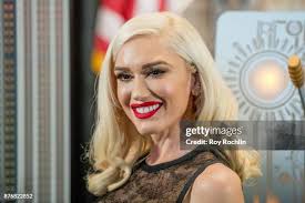 35 Gwen Stefani Lights The Empire State Building To Promote The Holiday  Light Show Photos & High Res Pictures