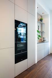 poggenpohl kitchen ijkelenstam keukens light design kitchen licht interieur taupe nissen miele greeploos nis keukens taupe keuken keuken interieur