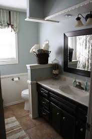 We conclude the bathroom looking dark because of the pairing with the wood category. 320 Sycamore Big Makeovers Traditional Bathroom Brown Bathroom Bathrooms Remodel