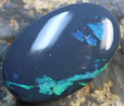 Items in stock and ready for delivery. 31 90 Cts Black Opal Electric Blue Green Cut Stone
