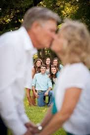 Parents Kissing Children Watching Family Photo Shoot Idea Wedding Anniversary Pictures 50th Wedding Anniversary Party Wedding Anniversary Photos