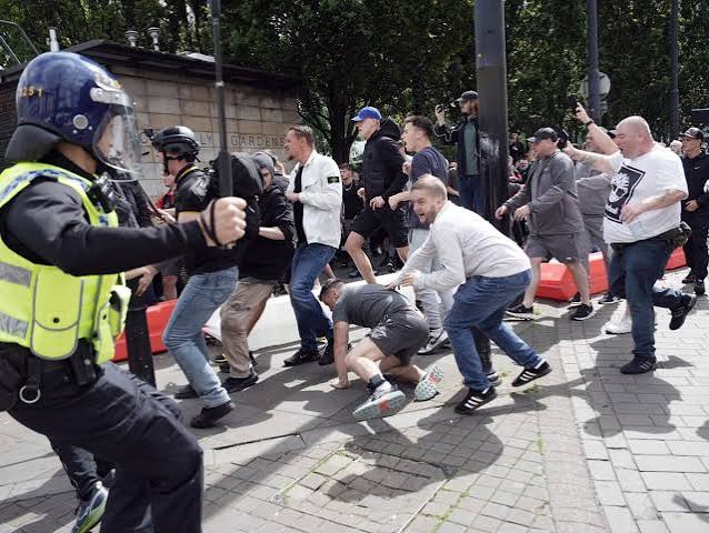 Dozens arrested in violent clashes across the country as government warns rioters 'will pay the price' | UK news | The Guardian