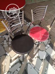 Mfstudio 5 pieces dining set,4 sling dining swivel chairs and 48 round metal wood grain table with 2 umbrella hole. Best Quality Round Sit Metal Chairs In Ibeju Furniture Smart Funiture Interiors Jiji Ng