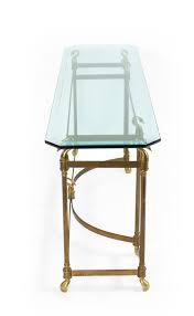 Shop console tables and other modern, antique and vintage tables from the world's best furniture dealers. Hollywood Regency Brass And Glass Console Table