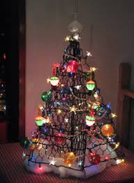 This foldable christmas tree is made from pvc coated crab wire and comes with lights that are ready to go. Crab Pot Trees Take Crab Traps And Turns Them Into Beautiful Christmas Trees