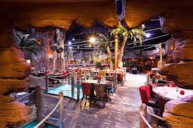 Kitchen was moved and expanded in 2014 by taking over the trophy room, a secondary dining area. Le Decor Magique De Pirates Paradise Restaurant A Odysseum Decor Restaurant Odysseum Outdoor Tiki Bar Tiki Bar Decor Pirate Decor