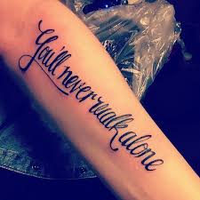 Hand tattoo can be considered to be the most popular tattoos ever worn all over the world. My First Tattoo You Ll Never Walk Alone It S Not Just Because I Am A
