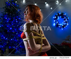 The red-haired girl is tied with a rope using... - Stock Photo [79107844] -  PIXTA