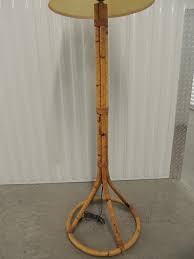 This lamp features silver accents with a tan drum shade. Vintage Tall Bamboo Floor Lamp At 1stdibs