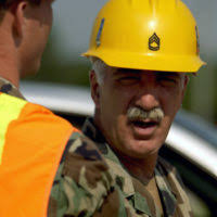 Lt. j.g. Patrick Shine observes wind damage in the attic of a chapel caused  by Hurricane Harvey at Naval Air Station Corpus Christi.