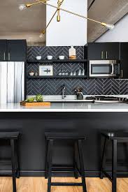 Thanks to white walls and white cabinets, the ebony wall tile adds a subtle pop of color to a splash of black can go a long way in the kitchen, especially if you go for a material that's a little bit extra. 39 Black Kitchen Cabinet Ideas Entering The Dark Side Modern Black Kitchen Interior Design Kitchen Black Kitchens