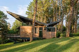 Large expanses of glass (windows, doors, etc) often appear in modern house plans and help to aid in energy efficiency as well as indoor/outdoor flow. Modern Butterfly Roofs Dwell