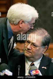 Archie Brooks, former chairman of the Central Iowa Employment Training  Consortium board, right, talks with his lawyer Tom Whitney before  testifying during the Legislative Oversight Committee meeting, Wednesday,  April 12, 2006, at the Statehouse in Des ...
