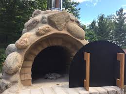 Dry stack wallsone, mini wallstone, boulders, columns, aqua sculptures and steps. The Reynolds Family Wood Fired Outdoor Pizza Oven With River Rock Veneer In Ontario Canada Mattone Barile Brickwood Ovens