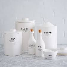 Like these ones, for instance: Utility Kitchen Canisters White Kitchen Storage Solutions
