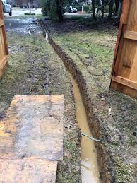 What many people don't realize is there are many considerations that go into designing and building a french drain. French Drain Contractor Jackson Madison Brandon Mississippi