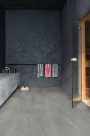 The Grey Vinyl Flooring Tiles Add A Beautiful Dark Look To This Stunning Modern Bathroom Discover More Inspi Grey Bathrooms Vinyl Flooring Vinyl Wall Covering