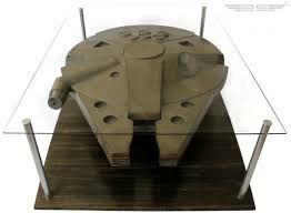 White base with shelf underneath glass. Millenium Falcon And Han Solo In Carbonite Coffee Table Anyone Yes Please Gadget Review