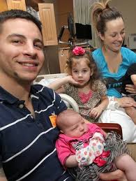 Home for the holidays: Marine arrives from Afghanistan to see newborn  daughter