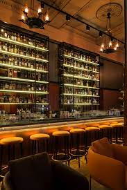 Keeping To A Rich Colour Palette The Architects Specially Crafted Red Velvet Chairs To Curve Around Each Ta Bar Interior Design Luxury Restaurant Bar Interior