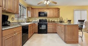 The Light Wood Definitely Makes A Nice Contrast With The Dark Appliances Yellow Kitchen Walls Yellow Kitchen Paint Yellow Kitchen