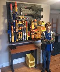 Behold 13 clever nerf gun storage ideas mum central from mumcentral.com.au starting to design what will be the gun rack wall to hold the guns. Pin On Man Cave