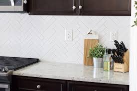 It can also be easily cleaned and maintained in any space. White Herringbone Backsplash With Light Grey Grout Novocom Top