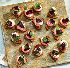 For this appetizer recipe the smoked salmon mousse is piped on crunchy seeded crackers and topped with a small sprig of dill and a couple pomegranate seeds. Majestic Morsels Scottish Smoked Salmon Mousse Crostini Hearts Daily Mail Online
