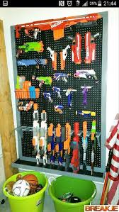 The guns themselves, the magazines, the darts, the accessories… it always ends up piled up on my dining table, left on the stairs, or laid against the wall of the living room. Nerf Gun Rack