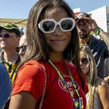 Gabby Thomas rocks stunning burnt orange fit to cheer