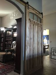 Interior Sliding Barn Door Made Of Hickory And Textured Glass Arched Glass Detail Arts And Craf Barn Doors Sliding Wood Doors Interior Sliding Doors Interior