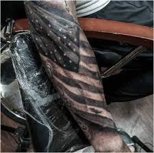 American Flag Chest Tattoo Black And Grey 10 Mysterious American Flag Tattoos Moderntattoodesigns Click To See More Flag Tattoo American Flag Tattoo Cool Forearm Tattoos