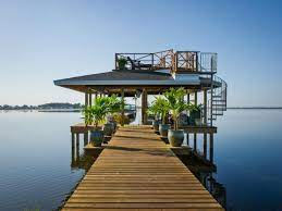 Wood dock with pipe bracket hardware for lakes and ponds. How To Work Around Dock Restrictions At Your Lake Home