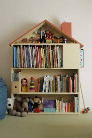 An ideal diy bookshelf in the living room, with a lot of decor pieces, paintings, family gallery wall, or. 30 Clever Ways To Store And Display Your Child S Books