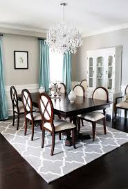 How To Make Wood Tones Work For You Use An Area Rug As A Buffer Dining Room Contemporary Traditional Dining Rooms Dining Room Chandelier