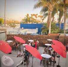 It features an expansive outdoor patio flanked by living walls, an indoor/outdoor bar, cabanas and a fire pit. San Diego Labor Day Weekend Brunch Guide