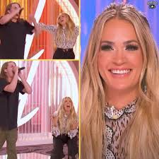 New American Idol judge Carrie Underwood got the chance to showcase her  rock and roll side when she jumped up to join one contestant's heavy metal  performance. Luke Bryan and Lionel Richie's
