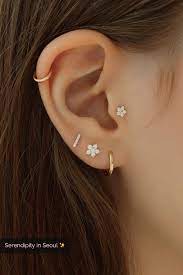 tiny flower labret piercing 14k gold earings piercings ear jewelry pretty ear piercings