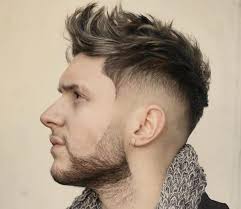 The mohawk (also referred to as a mohican) is a hairstyle in which, in the most common variety, both sides of the head are shaven, leaving a strip of noticeably longer hair in the center. Fohawk Fade 15 Coolest Fohawk Haircuts And Hairstyles In 2021